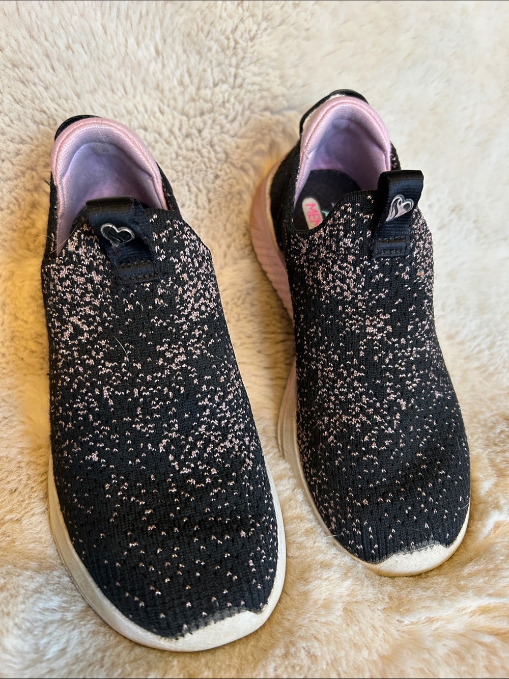 Skechers Kids Slip-On Knit Sneakers in Black with Pink Accents